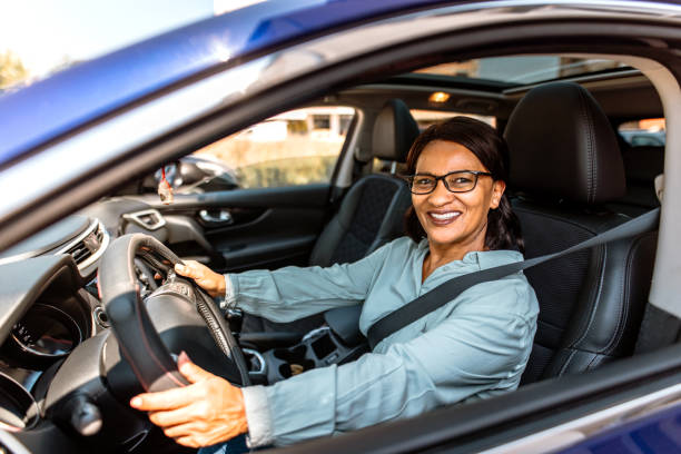 istock Senior woman driving a car 2151332556
