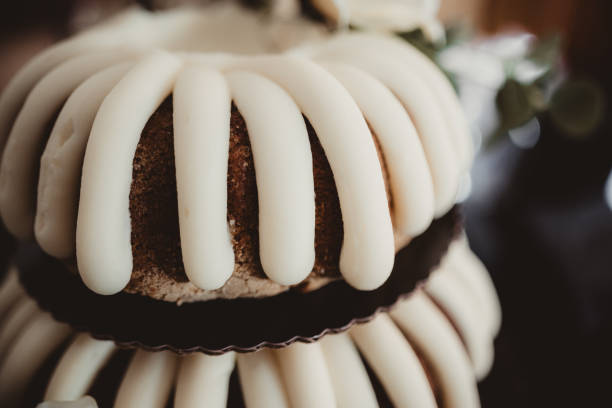 Frosting on a tiered wedding cake close up