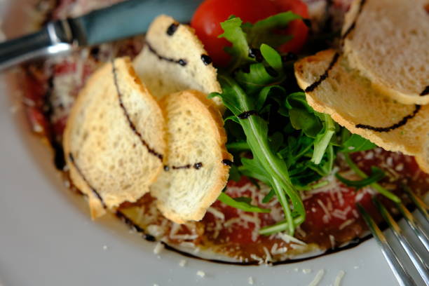 Italian culture. Freshly home prepared bresaola on a tray