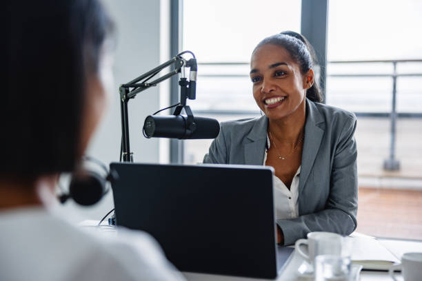 istock Collaborative Podcast Discussion in Corporate Lounge 2151338564