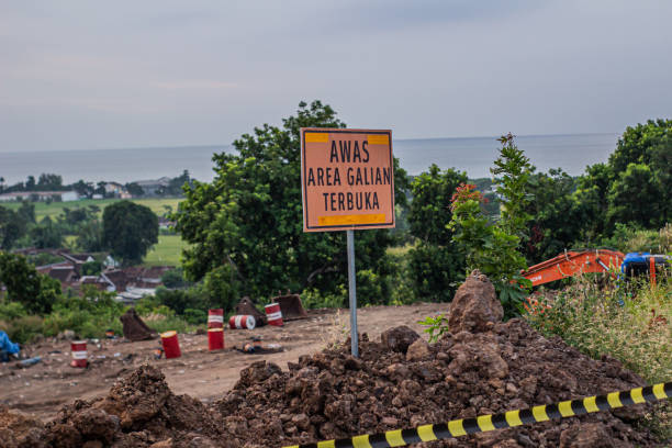 istock Signs indicating that there is open excavation in the toll road project area 2151343257