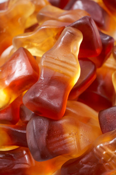 istock Creative atmosphere of sweet soft soda gummies on white background 2151353002
