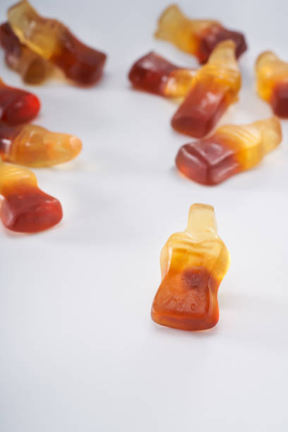 istock Creative atmosphere of sweet soft soda gummies on white background 2151353005