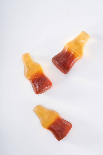 istock Creative atmosphere of sweet soft soda gummies on white background 2151353022