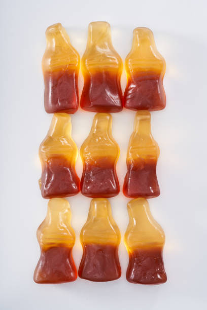 istock Creative atmosphere of sweet soft soda gummies on white background 2151353032