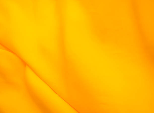 istock Yellow Background Cloth Fabric Orange Color Gradient Texture Pattern Silk Wave Banner Gold, Fashion Material Backdrop Poster for Summer Tropical Travel Holidays, Satin Mockup Luxury Premium. 2151354281