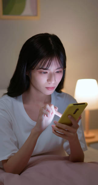 istock woman use smartphone at night 2151358575