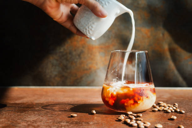 istock a glass of homemade cold cold brew coffee with ice on rustic table background. 2151364580