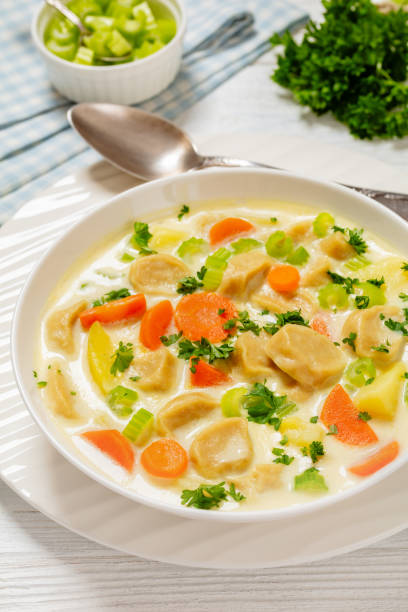 istock Knoephla soup, german dumpling soup in a bowl 2151367328