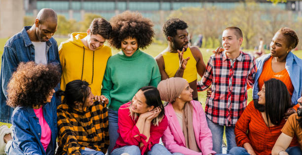 istock Vibrant Multicultural Group Enjoying a Friendly Gathering in the Park 2151368338