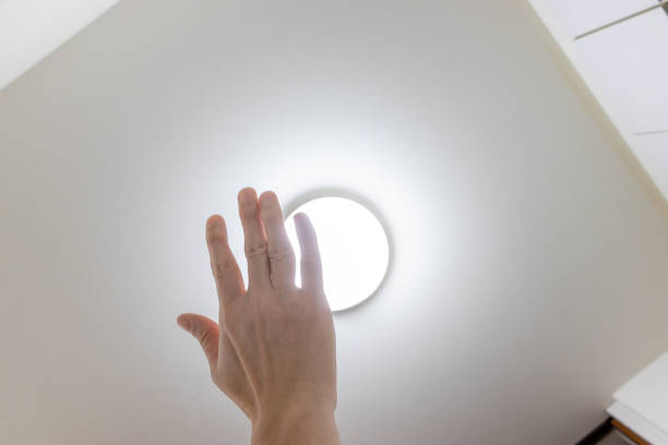 istock Block the bright light from the ceiling light with a hand 2151368853