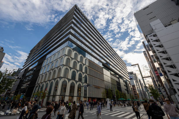Tokyo, Japan - November 23, 2023 : Pedestrians walk past the commercial complex Ginza Six in Tokyo's Ginza shopping district, Japan.