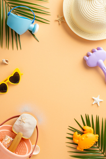 A vibrant vertical assortment of summer beach items, including a blue watering can, straw hat, sunglasses, and sand toys with tropical leaves and starfish accents on a warm pastel backdrop