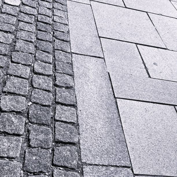 istock Stone walkway and cobblestone street 2151382176