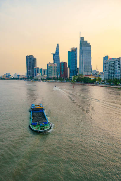 istock Bitexco Tower, captured from the perspective of Ba Son Bridge, frames a breathtaking sunset over Ho Chi Minh City. 2151383632