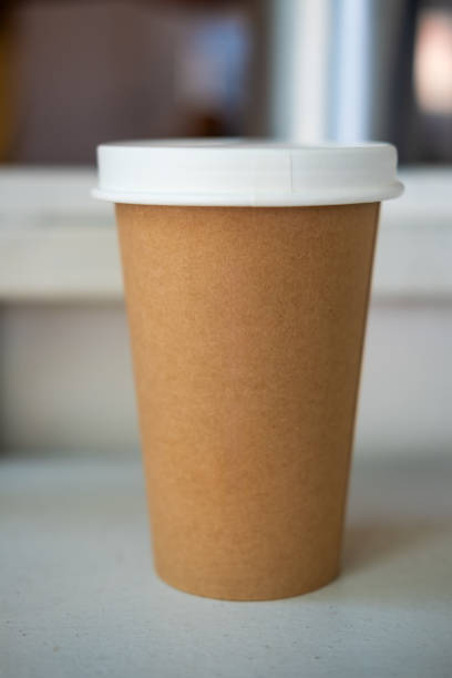 istock Brown paper cup with white lid of hot coffee 2151384134
