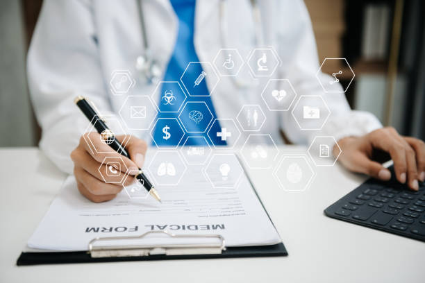 istock Medical technology concept. Doctor working with mobile phone and stethoscope and digital tablet laptop in office at hospital 2151386564