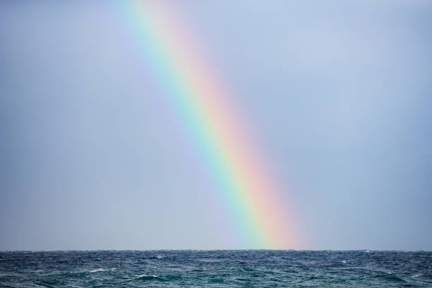 Beautiful rainbow landing on the oceans horizon