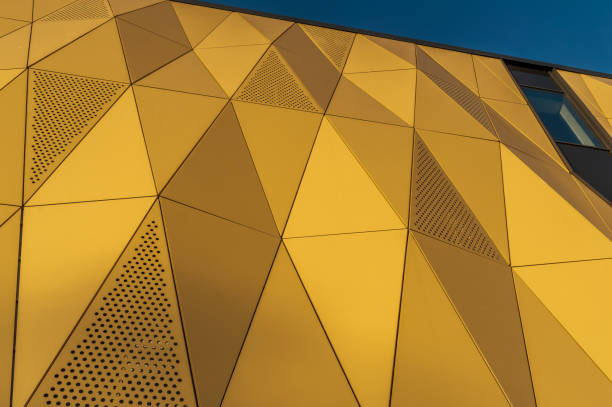 istock Facade of modern office building made of many triangles 2151387257