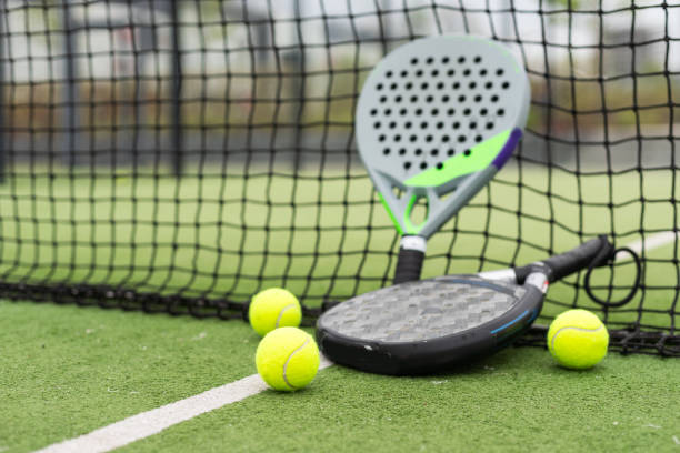 istock Paddle tennis objects on grass court 2151389378