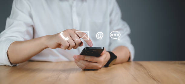 istock Customer support hotline Contact us people connection. Businessman using Smart Phone. 2151389803