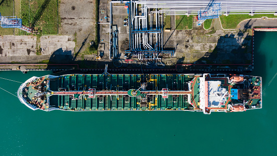 Container Port Structure A Cargo Ship Is Docked At An Industrial Port Its Structure A Complex ...