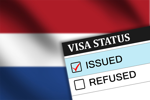 Netherlands visa issued showing on paper background. Visa of netherland status in blue color with flag