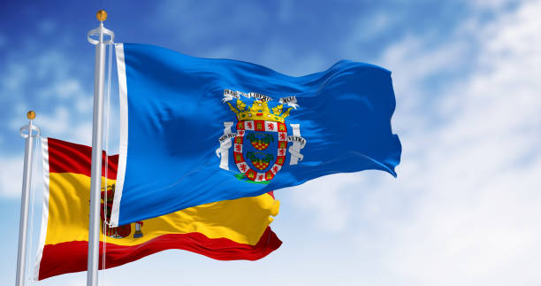 istock Melilla and national spanish flag flag waving on a clear day 2151396869