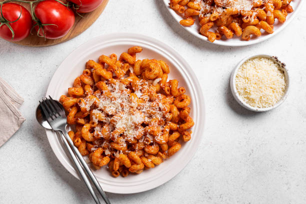 istock Cavatappi pasta with tomato sauce and parmesan cheese 2151398504
