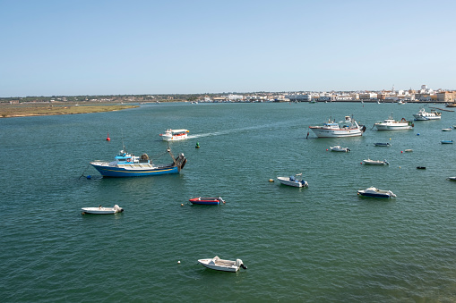 Isla Crisitna, Huelva, Spain - August 12, 2023: Different fishing and recreational boats based in the Playa del Caiman on Isla Cristina