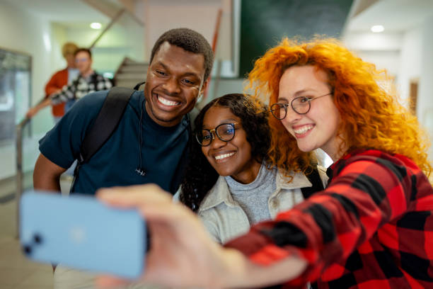 istock Cheerful Diverse College Students Taking Selfie Photo 2151403559