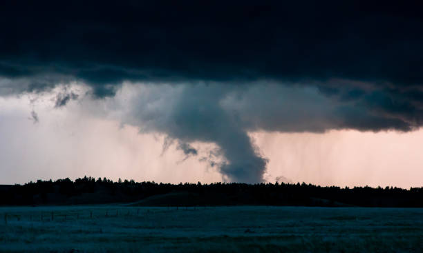 istock Menacing Tornado In The Dark Lit Up By Flashes Of Lightning 2151404735