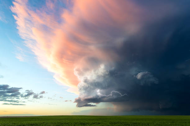 istock Soft Sunset Colors Light Up A Fading Storm Cloud 2151404758
