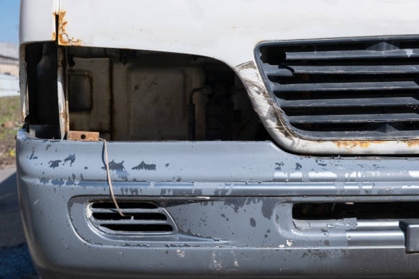 istock Car hood without a headlight and with a worn plastic bumper 2151408801