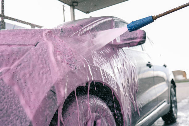 istock Hand washing car with pink foam, advertising 2151411256