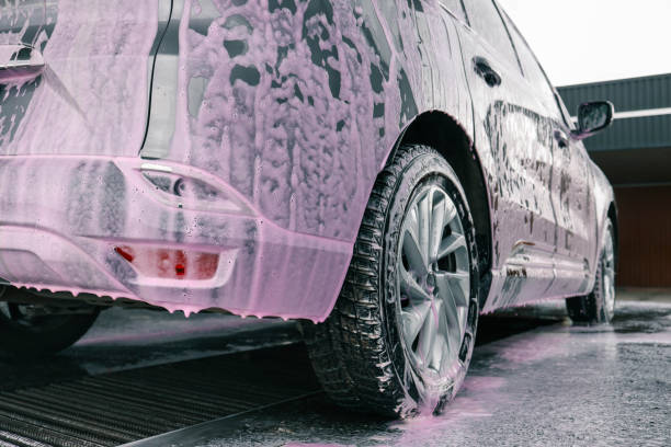 istock Hand washing car with pink foam, advertising 2151411263