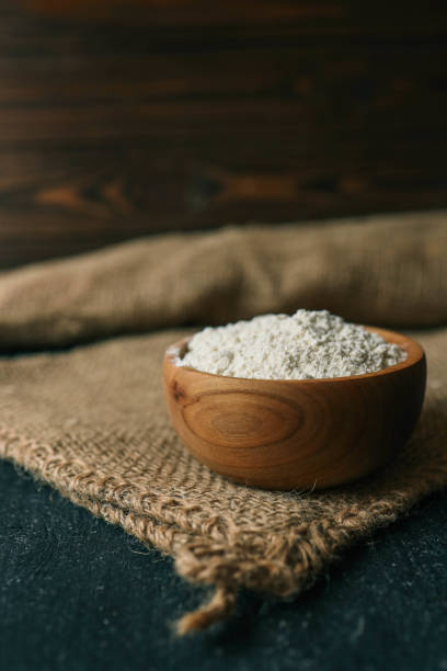 istock Flour in a wooden bowl on burlap 2151411392