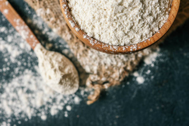 istock Flour in a wooden bowl on burlap 2151411394