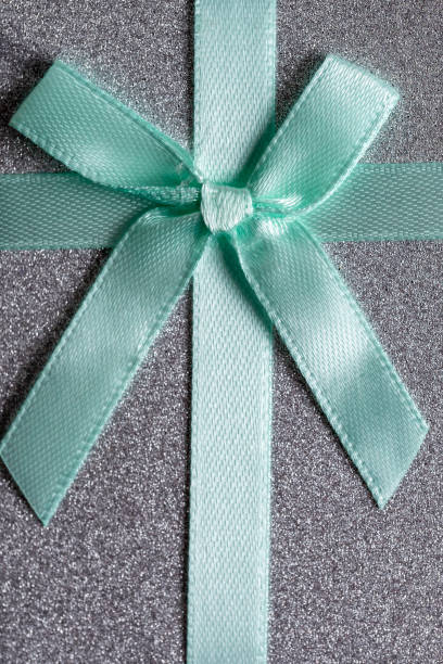 Christmas decorative bow in a white frame on a colored background