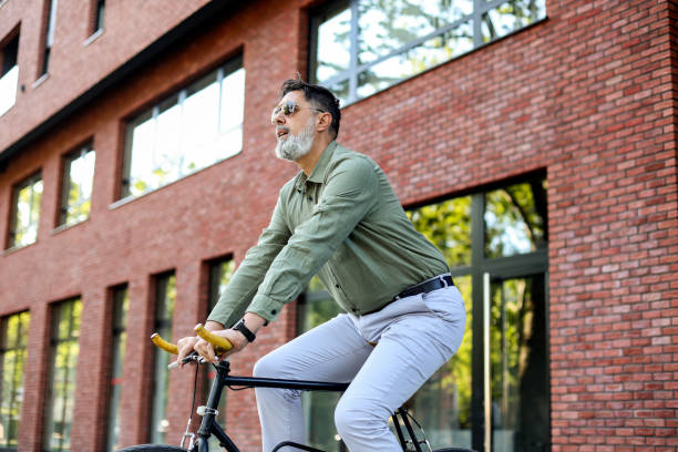 istock Man riding a bicycle in a city 2151416819
