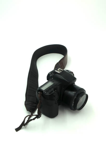 istock Black digital SLR camera in a white background 2151416947