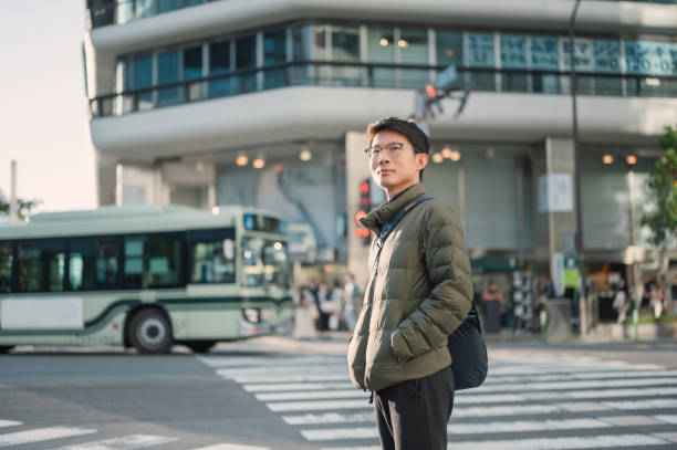 istock 30S japanese businessmen using mobilephone mobile application searching for location from AI smart data to travel alone in Osaka japan 2151417060