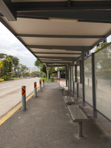 istock wide and long but empty bus stop during the day 2151422086