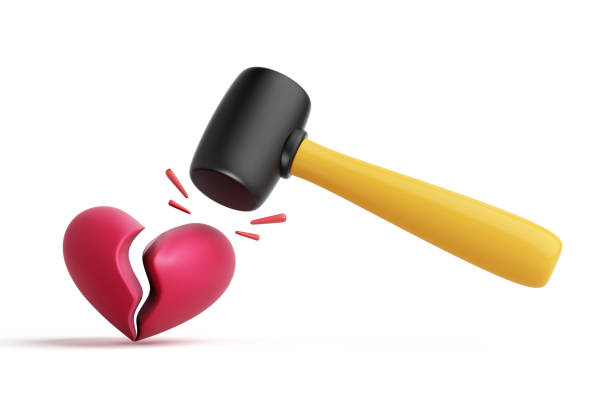 istock A rubber hammer is pounding a cracked red 3D heart symbol on a white background. About problems with relationship breakup, heartbreak, betrayal, blackmail. Objects with clipping path. 3D Illustration. 2151423909