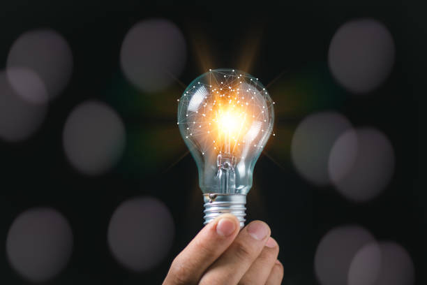 istock businessman hand holding light bulb. idea concept with innovation and inspiration 2151424182
