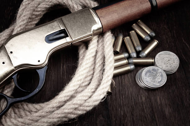 Cowboy holds a revolver and sits on a wooden barrel