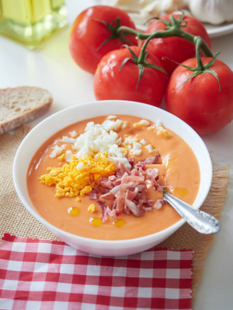 istock Creamy Spanish cold tomato and bread soup called salmorejo with diced ham and chopped egg on top. 2151430387