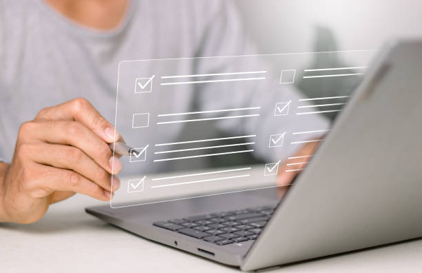 istock Business performance checklist concept, businessman using laptop doing online checklist survey, filling out digital form checklist. 2151433472
