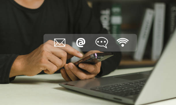 istock Contact us or Customer support hotline people connect. Businessman using a laptop and touching on virtual screen contact icons ( email, address, live chat, internet wifi ). 2151433490