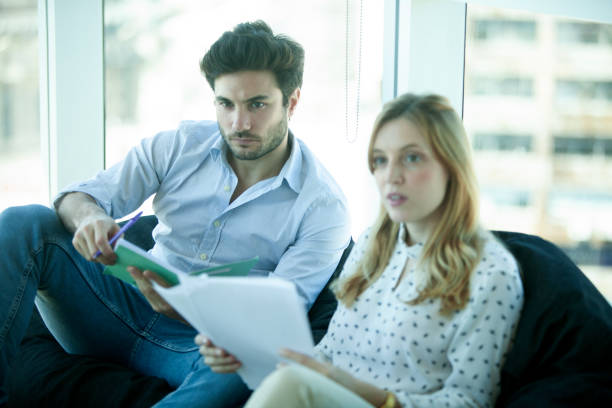 istock Business partners taking and working in the office 2151435264